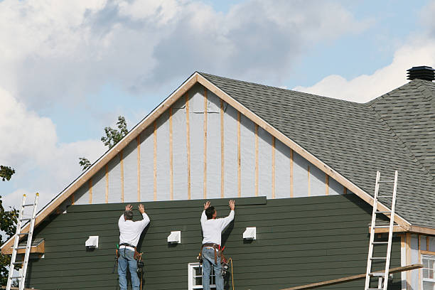 Professional Siding Installation technician working in Woodmere, NY